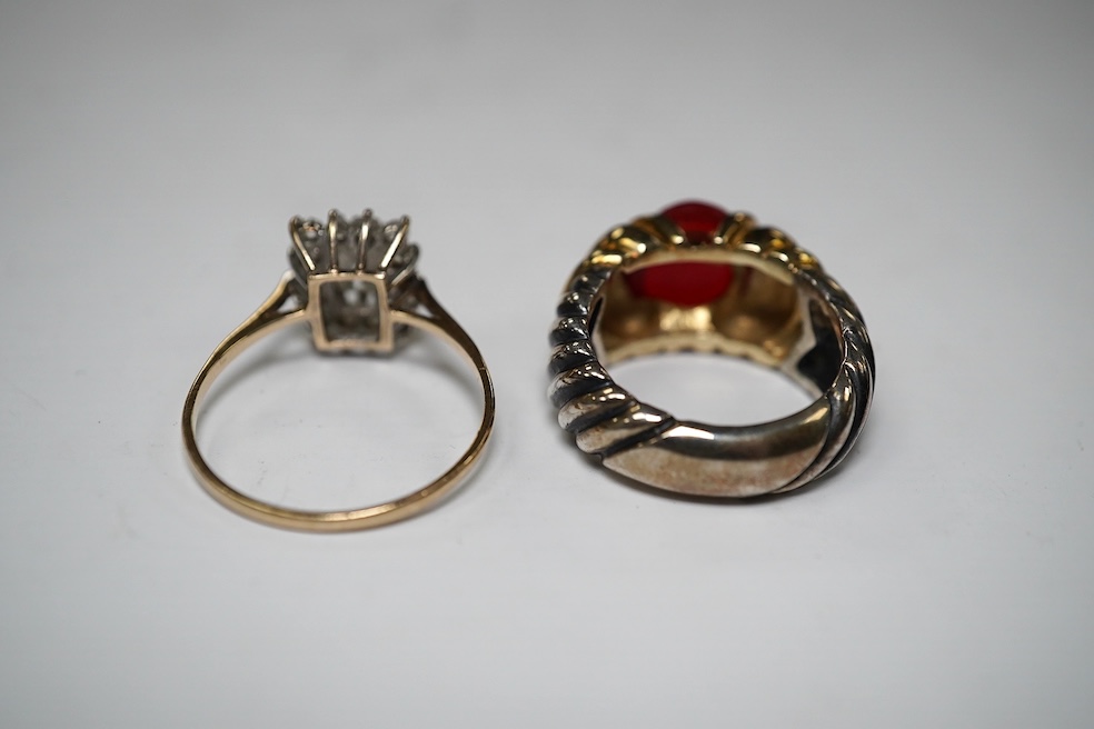 A gold and simulated diamond cluster set ring and a 14k and sterling set ring with cabochon stone. Condition - fair